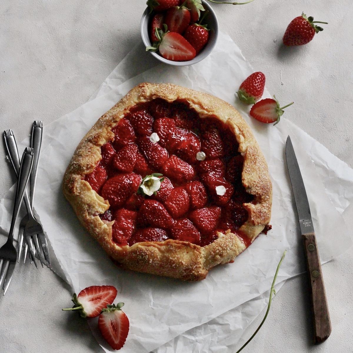 Top down shot of a baked strawberry galette.