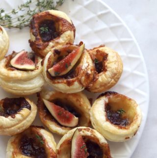 Fig and brie puff pastry bites served with fresh fig slices.
