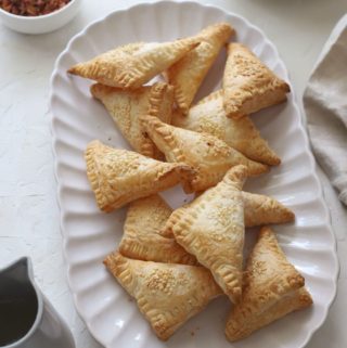 A platter of sweet cream cheese hand pies.