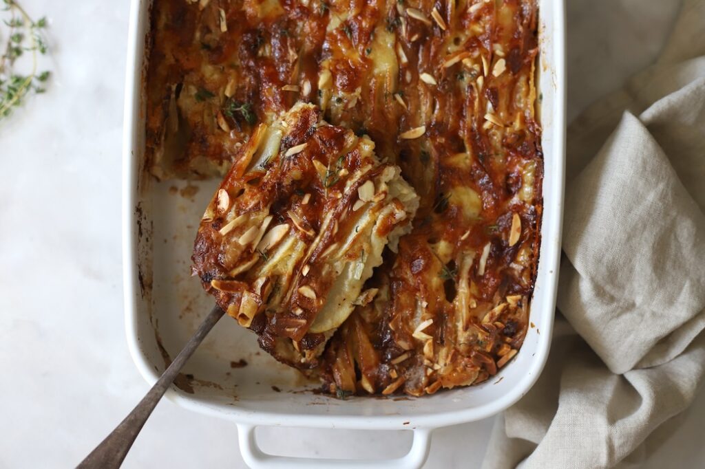 Sliced Pear and Camembert Tart in ceramic dish.